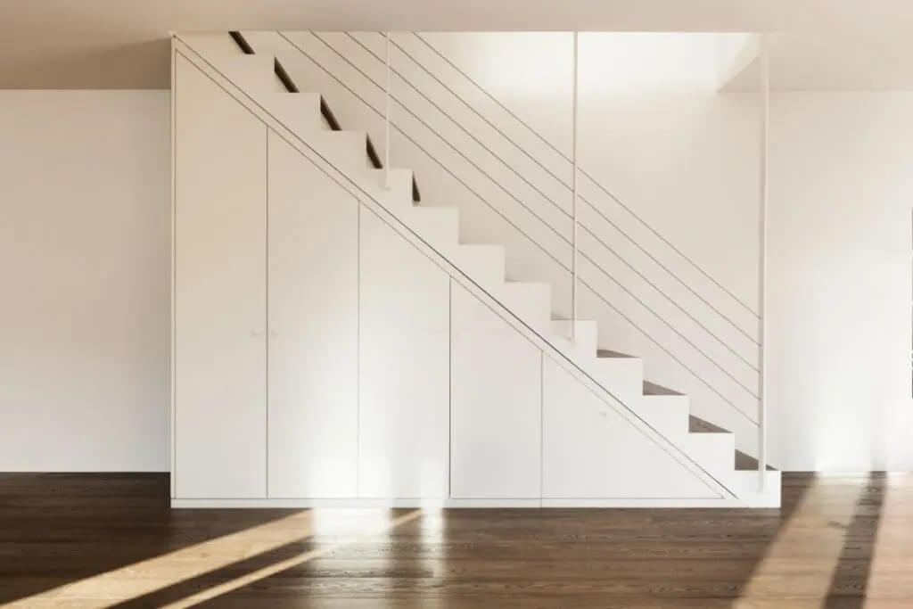 built-in closet under stairs